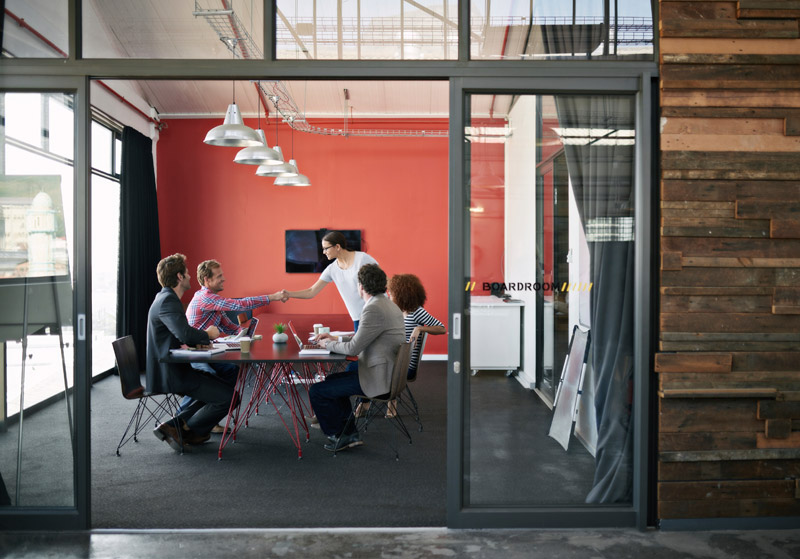 People sitting in meeting room.