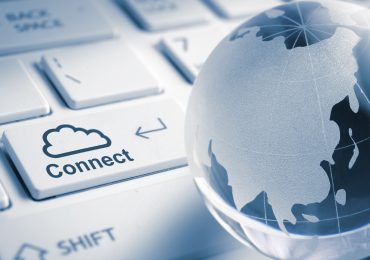 Globe over keyboard - Cloud connect.